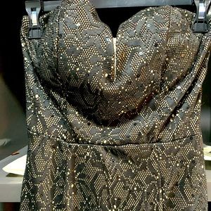 Stunning black dress with beige under.